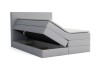 Hellgraues Boxspringbett mit funktionalem Stauraum und offenem Bettkasten.
