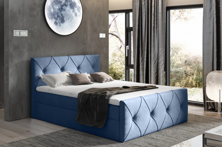 Blaues Boxspringbett mit moderner Rautensteppung an Kopf- und Fußteil.
