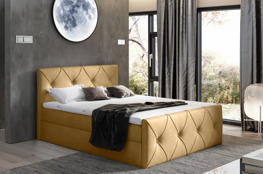 Senfgelbes Boxspringbett mit gestepptem Design als farbliches Highlight.