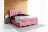 Rosa Boxspringbett mit gestepptem Kopfteil in modernem Schlafzimmer.