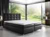 Schwarzes Boxspringbett mit elegantem Karomuster-Kopfteil und weißem Topper.