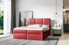 Rotes Boxspringbett als Blickfang im hellen Schlafzimmer mit minimalistischer Deko.