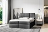 Schwarzes Boxspringbett aus hochwertigem Material in elegantem Schlafzimmer-Look.