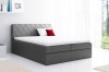 Anthrazitfarbenes Boxspringbett mit dekorativem Rautenmuster am Kopfteil und Topper.