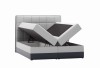 Graues Boxspringbett mit zwei offenen Bettkästen und hohem gestepptem Kopfteil auf weißem Hintergrund.