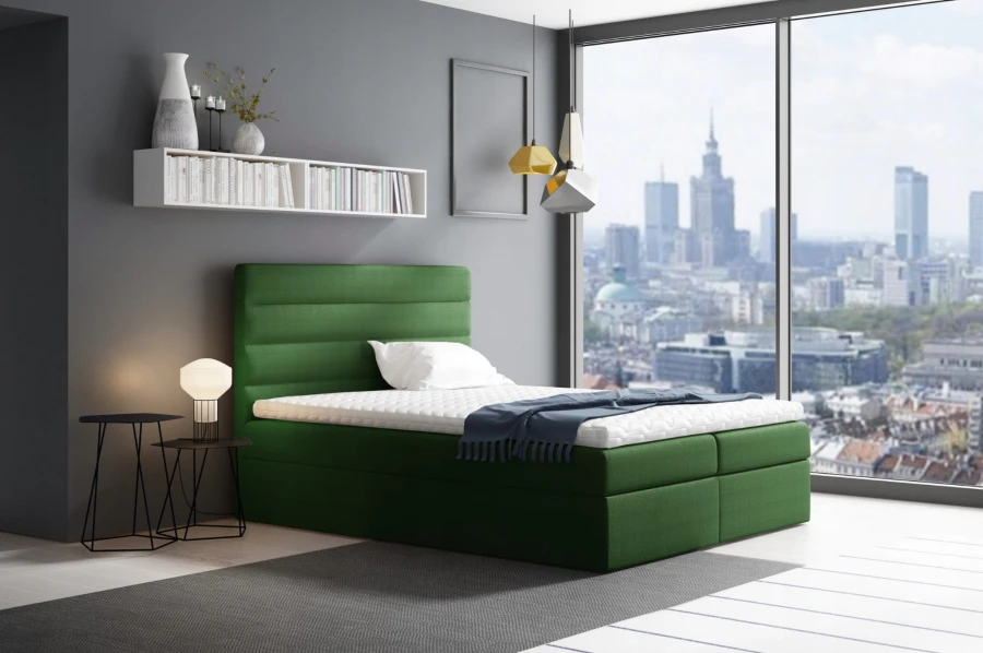 Grünes Boxspringbett in elegantem Design, platziert in einem modernen Schlafzimmer.