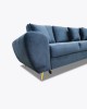 Blaues Samtsofa mit eleganten goldenen Füßen in Nahaufnahme.