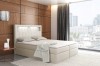 Beiges Boxspringbett mit integriertem LED-Licht im Kopfteil und elegantem Design.