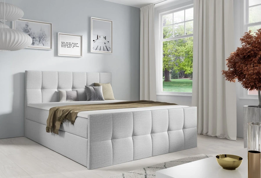 Hellgraues Boxspringbett mit weichem Polster-Kopfteil für das Schlafzimmer