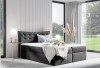 Zeitloses Boxspringbett in Anthrazit mit Samt-Optik und gestepptem Kopfteil für ein elegantes Schlafzimmer.