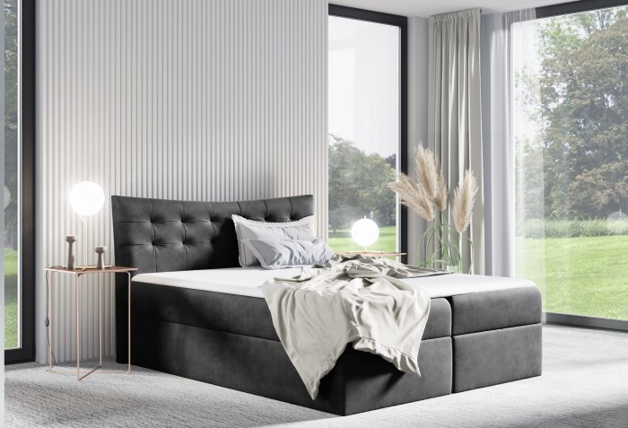 Anthrazitfarbenes Boxspringbett mit gestepptem Samt-Kopfteil und weißer Decke.