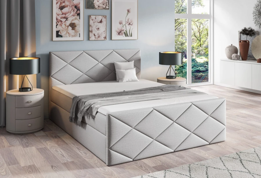 Hellgraues Boxspringbett mit elegantem Rauten-Design im modernen Schlafzimmer-Ambiente.