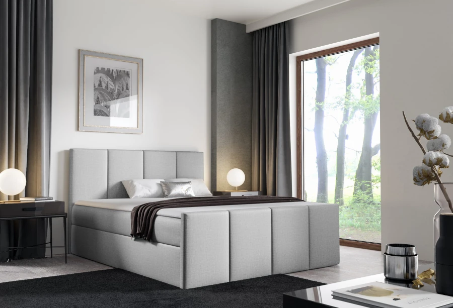 Hellgraues Boxspringbett mit vertikal gestepptem Kopfteil in modernem Schlafzimmer.