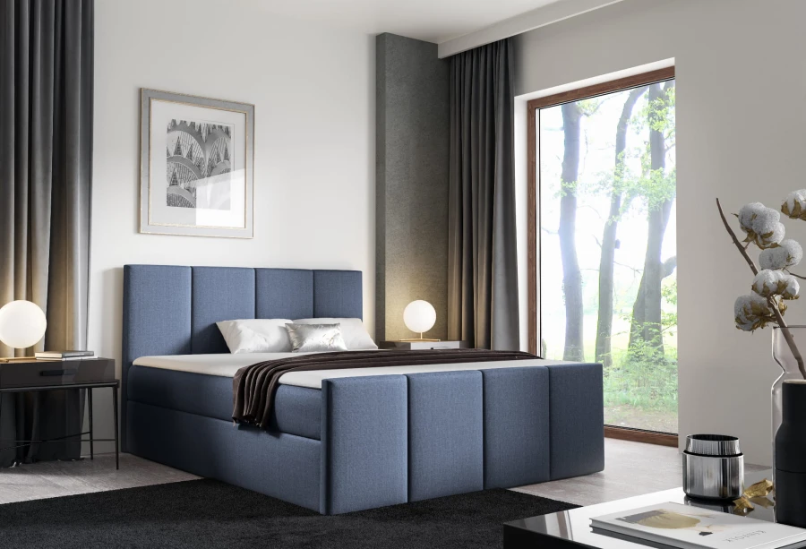 Stilvolles blaues Boxspringbett mit gepolstertem Kopfteil.