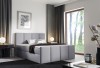 Modernes hellgraues Polsterbett in minimalistischem Design.
