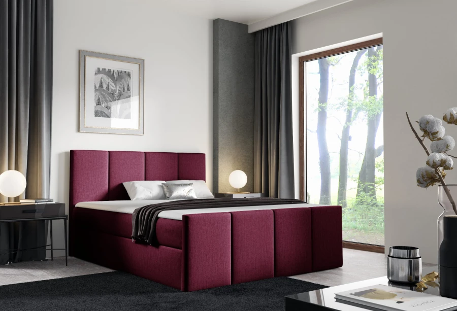 Weinrotes Boxspringbett im luxuriösen Schlafzimmer-Design mit hohem Komfort.