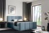 Blaues Polsterbett in modernem Design für ein gemütliches Schlafzimmer.