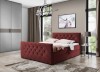 Luxuriöses bordeauxrotes Boxspringbett mit Knopfheftung in einem modernen Schlafzimmer Design.