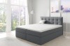 Modernes Boxspringbett in Dunkelgrau mit gestepptem Kopfteil.
