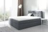 Graues Boxspringbett mit gestepptem Kopfteil in einem modernen Schlafzimmer mit City-View