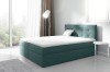 Boxspringbett in Petrol mit weißem Topper und gepolstertem Kopfteil im Schlafzimmer