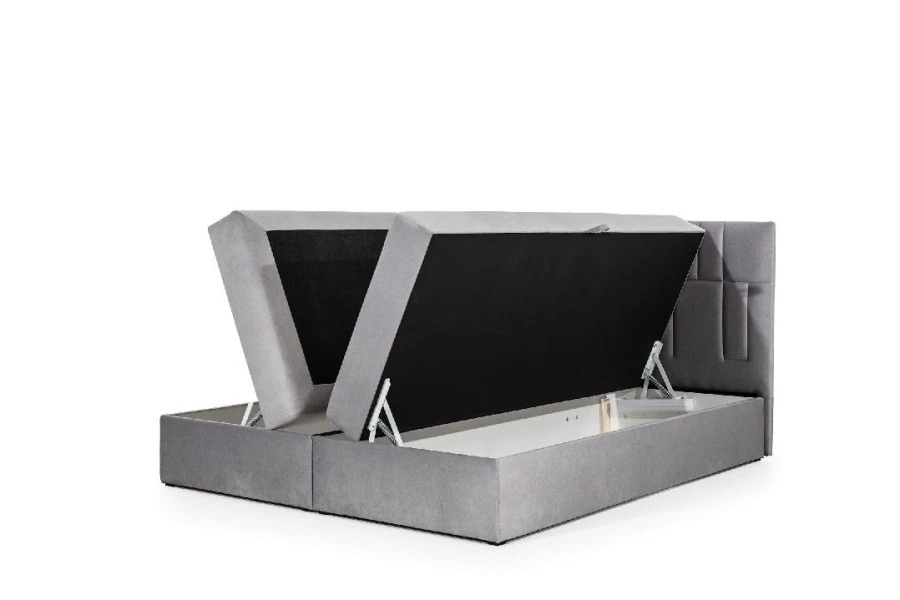 Boxspringbett mit Bettkasten-Funktion für extra Stauraum, aufgeklappt.