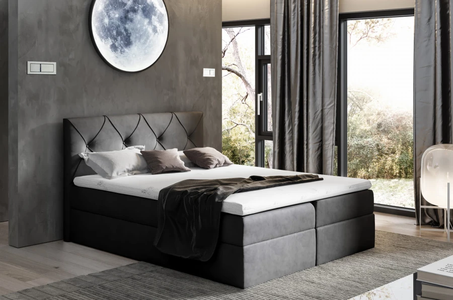 Dunkelgraues Boxspringbett Anthrazit mit abgestepptem Kopfteil.