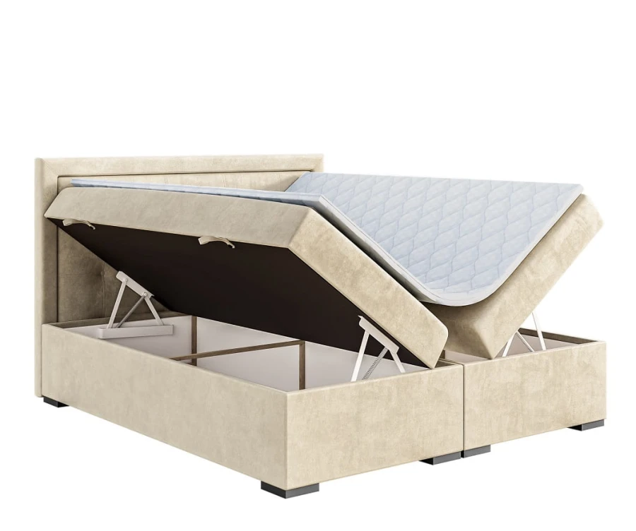 Beiges Boxspringbett mit zwei aufgeklappten Bettkästen für zusätzlichen Stauraum.