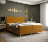 Gelbes Boxspringbett als Farbakzent in modernem Schlafzimmer-Design