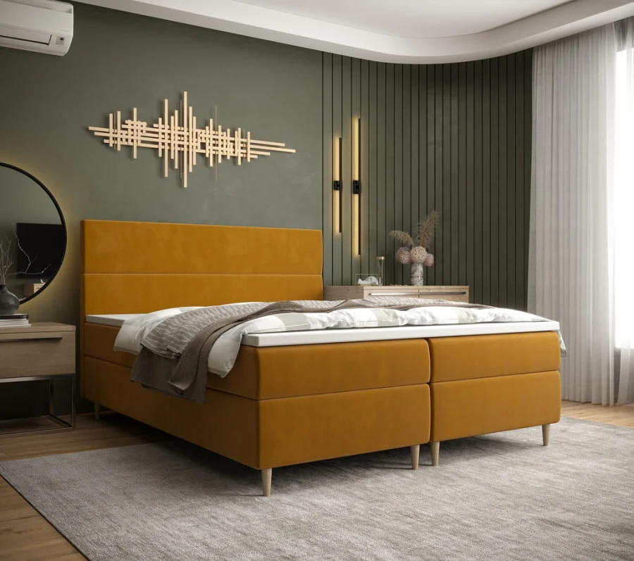 Gelbes Boxspringbett als Farbakzent in modernem Schlafzimmer-Design