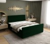 Dunkelgrünes Boxspringbett in modernem Design für erholsamen Schlaf.