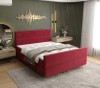 Auffälliges rotes Polsterbett in einem modern gestalteten Schlafzimmer.