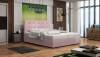 Elegantes rosa Boxspringbett mit gepolstertem Kopfteil in modernem Schlafzimmerambiente.