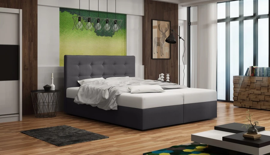 Anthrazitfarbenes Boxspringbett in einem modernen Schlafzimmer mit großen Fenstern.