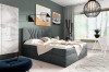 Elegantes graues Boxspringbett aus Samt in einem modern eingerichteten Schlafzimmer.