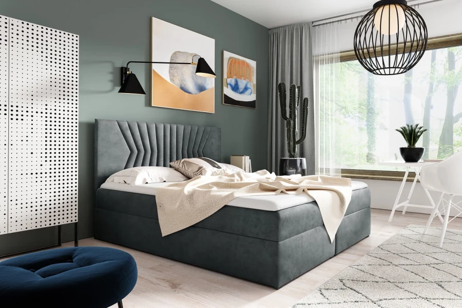 Elegantes graues Boxspringbett aus Samt in einem modern eingerichteten Schlafzimmer.