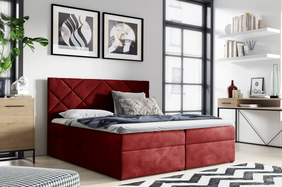Rotes Boxspringbett mit elegantem gestepptem Kopfteil als Farbakzent im Schlafzimmer.