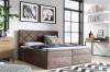 Stilvolles Boxspringbett in Taupe mit gestepptem Kopfteil im modernen Schlafzimmer.