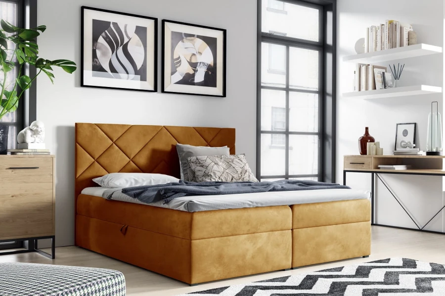Senfgelbes Boxspringbett mit samtigem Bezug und gestepptem Kopfteil im modernen Wohndesign.