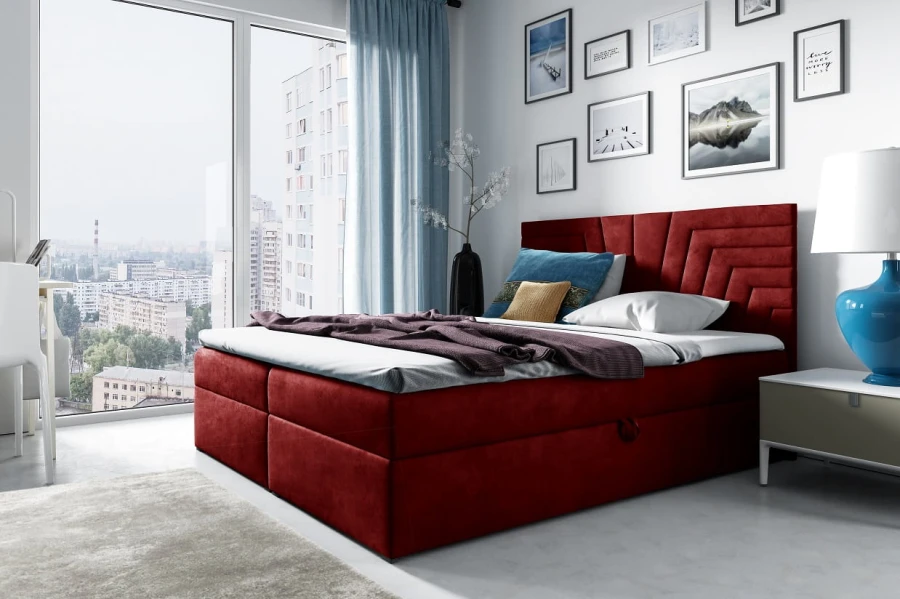 Rotes Boxspringbett als farbiger Akzent in einem modernen Schlafzimmer