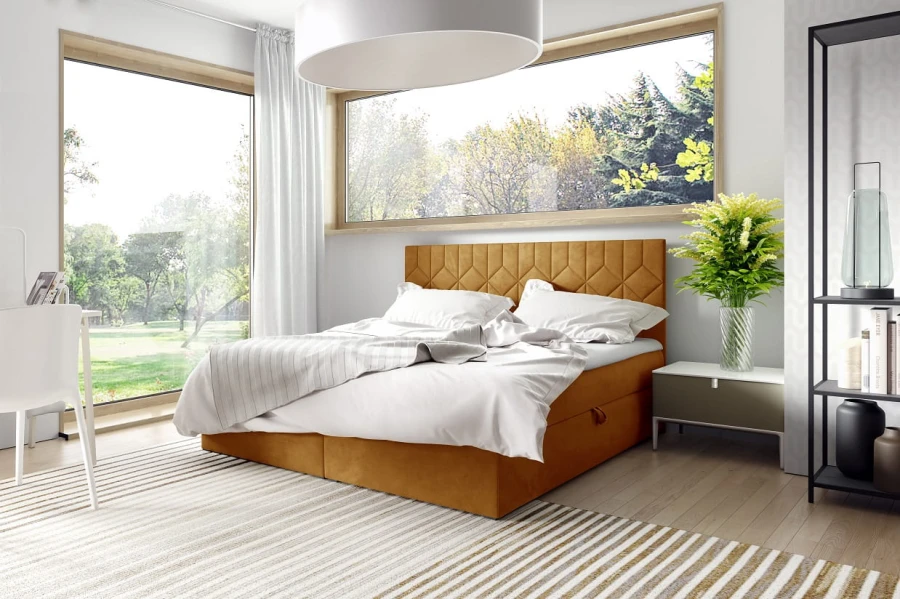 Senfgelbes Boxspringbett als Farbakzent in hellem Schlafzimmer