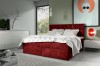Rotes Boxspringbett als Farbakzent in einem modern eingerichteten Schlafzimmer.