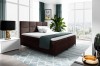 Dunkelbraunes Boxspringbett im modernen Design mit Stoffbezug und Stadtblick.