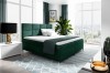 Modernes Boxspringbett in Smaragdgrün mit gestepptem Kopfteil im hellen Schlafzimmer.