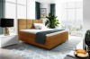 Stilvolles Boxspringbett in warmem Senfgelb für ein modernes Schlafzimmer-Ambiente.