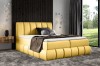 Elegantes gelbes Boxspringbett für ein stilvolles Schlafzimmer
