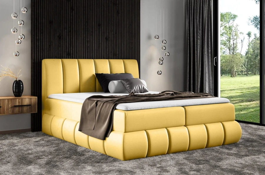 Elegantes gelbes Boxspringbett für ein stilvolles Schlafzimmer