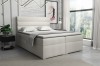 Beiges Boxspringbett mit elegantem Kopfteil im Schlafzimmer