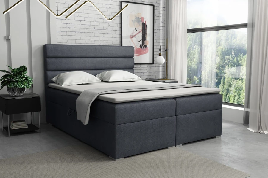 Blaues Boxspringbett in modernem Design für hohen Schlafkomfort