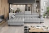 Graues L-Sofa in stilvollem Wohnzimmer mit moderner Einrichtung
